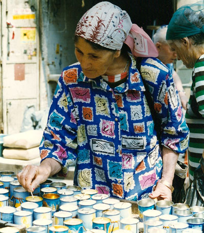 Old lady lighting candles